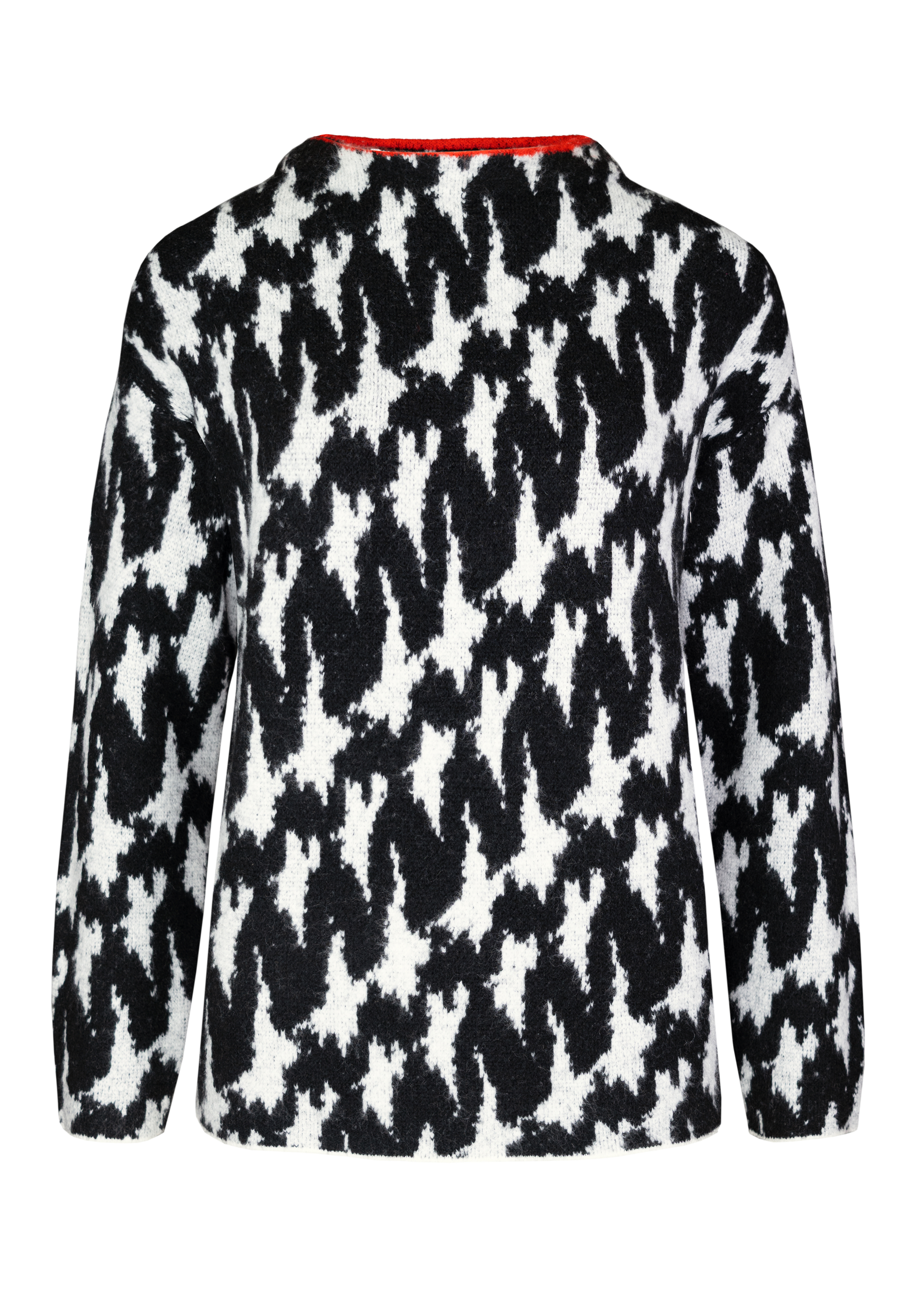 Ein langärmeliger Pullover mit einem auffälligen abstrakten Muster in Schwarz und Weiß, der sich durch eine flauschige Struktur und eine lockere Passform auszeichnet. Der Ausschnitt weist auf der Innenseite einen leichten Rotstich auf. Der Pullover ist vo